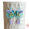 Boucles d'oreilles colibris attrape-rêves mauve bleu vert menthe beige fleurs feuilles rosaces par Odacassie